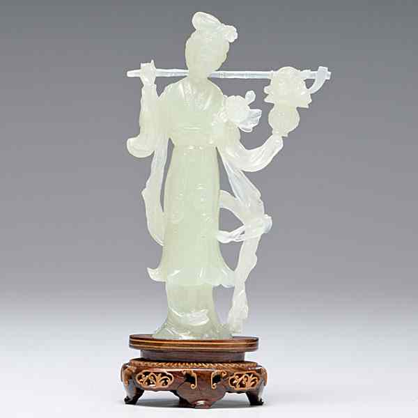 Appraisal: Jade Guanyin Chinese an unmarked carved jade Guanyin wearing flowing