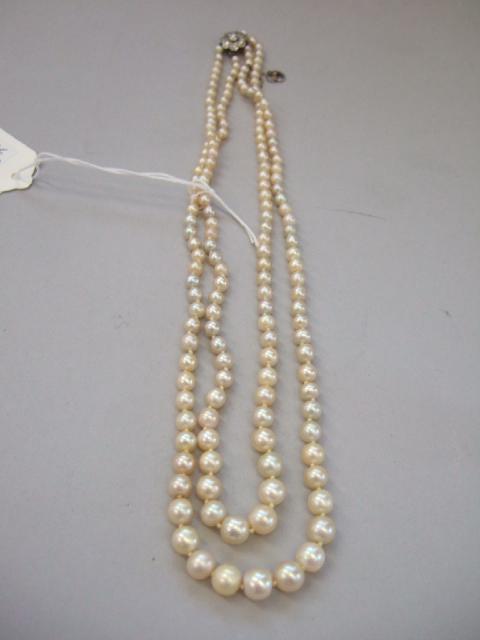 Appraisal: A two row necklace of cultured pearls graduating in size