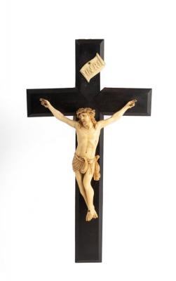 Appraisal: A resin crucifix the carved figure of Christ to an