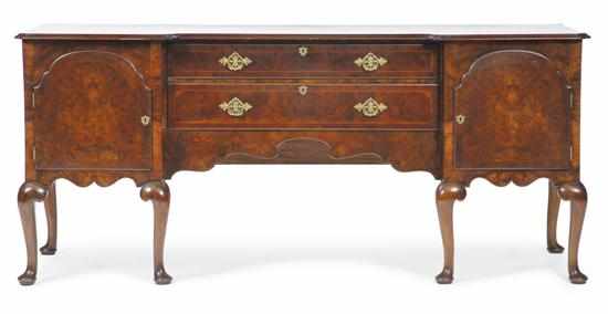 Appraisal: A QUEEN ANNE STYLE FIGURED WALNUT SIDEBOARD CIRCA The reverse