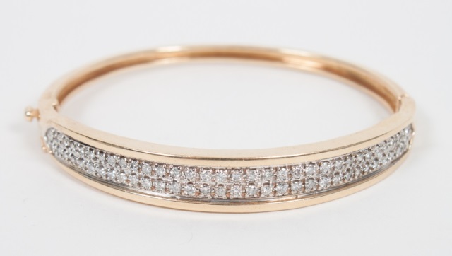 Appraisal: Lady's K gold and diamond bangle bracelet interior dimensions X