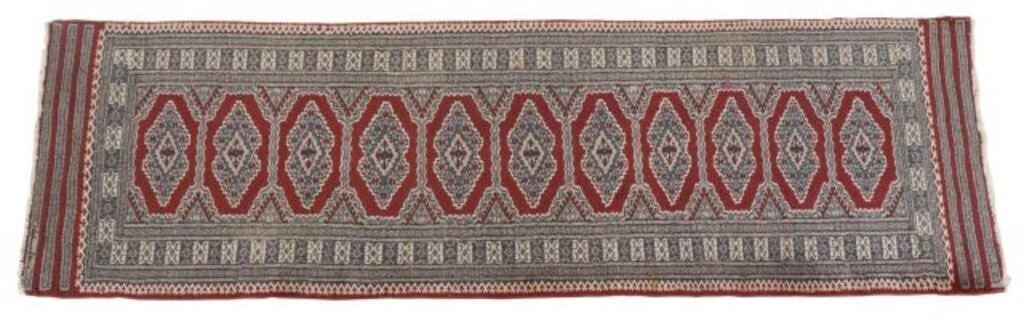 Appraisal: Hand-tied Bokhara runner Pakistan imperfection to corner edge binding approx