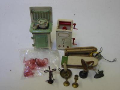 Appraisal: A Taylor and Barrett doll's house cooker with kettle and