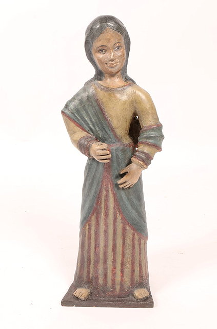 Appraisal: AN INDIAN GOA CARVED WOOD CHRISTIAN FIGURE perhaps Mary in