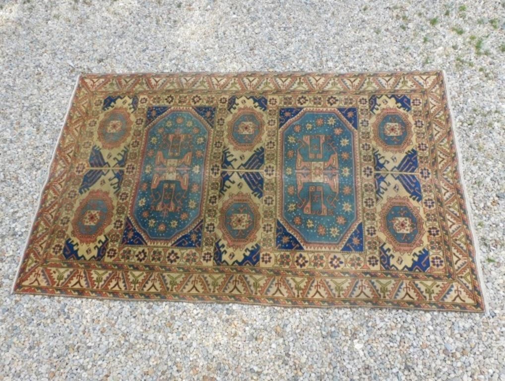 Appraisal: CAUCASIAN RUG CA BEIGE FIELD GEOMETRICdesign with two panels surrounded