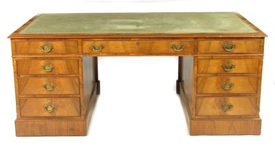 Appraisal: A walnut pedestal desk by Maples the gilt tooled leather