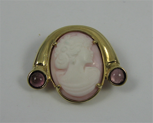 Appraisal: GRAPE TOURMALINE CAMEO AND K GOLD BROOCH PENDANT set with