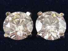 Appraisal: A pair of diamond solitaire earrings the round brilliant cut