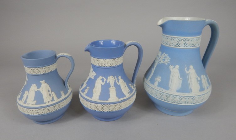 Appraisal: An associated graduated set of three Wedgwood Jasperware jugs to