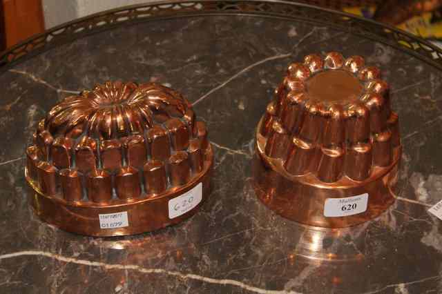 Appraisal: TWO TH CENTURY POLISHED COPPER JELLY MOULDS of stylised form