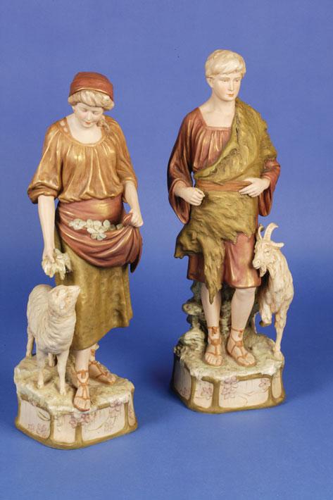 Appraisal: A PAIR OF ROYAL DUX FIGURES of a goatherd and