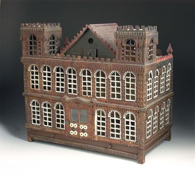 Appraisal: A th century carved wood and painted birdcage modelled as