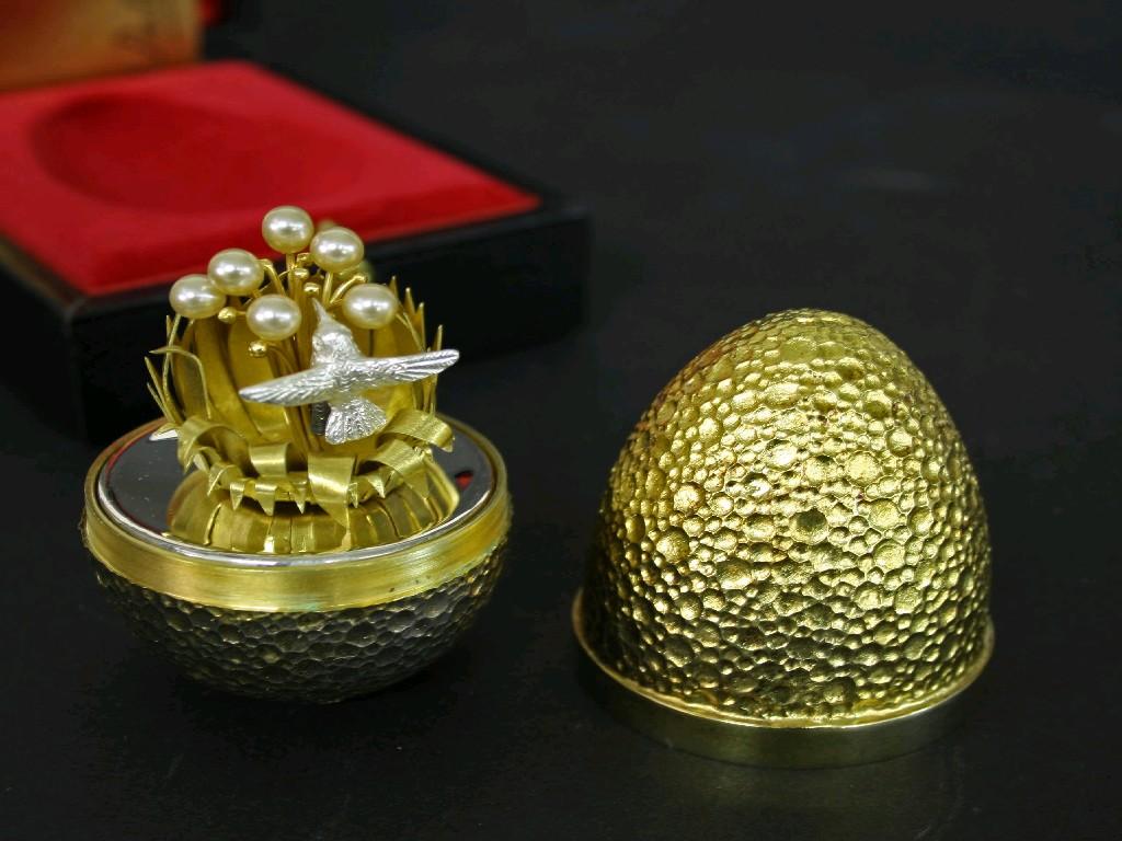 Appraisal: Stuart Devlin silver-gilt Easter egg limited edition the planished egg