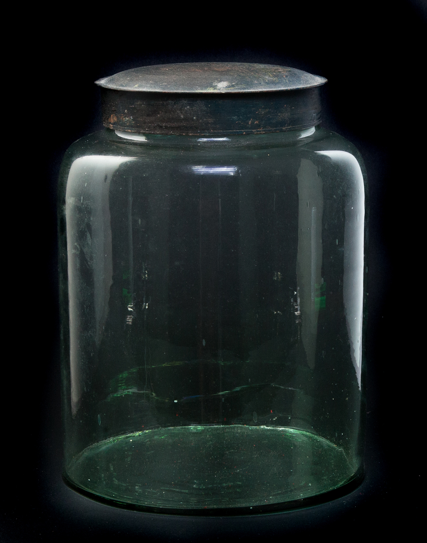 Appraisal: AMERICAN BLOWN GLASS CANISTER Mid th century Green tinted glass