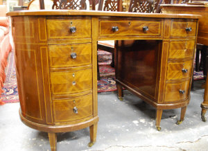 Appraisal: A late Victorian inlaid walnut kidney-shaped desk with tooled leather