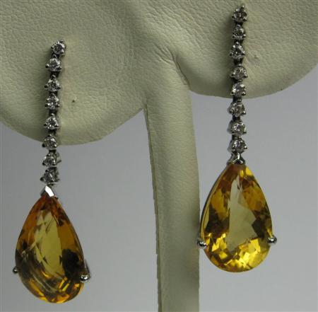 Appraisal: A contemporary citrine and diamond set suite comprising a pendant