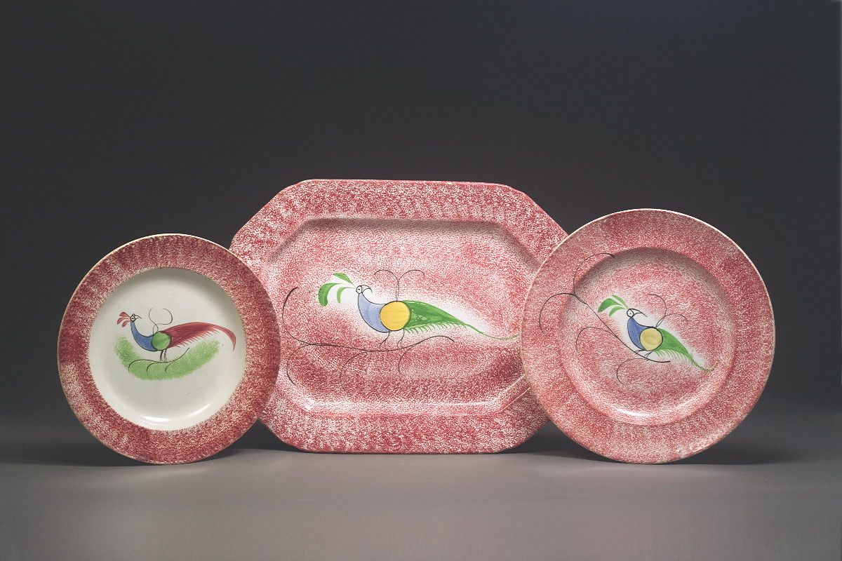 Appraisal: TWO STAFFORDSHIRE RED SPATTERWARE 'PEAFOWL' PATTERN PLATES CIRCA The first