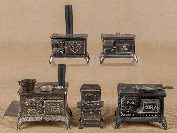 Appraisal: Five cast iron toy stoves to include a Grey Iron