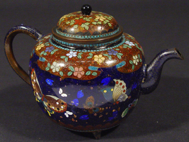 Appraisal: Oriental cloisonne teapot and cover enamelled with flowers and leaves