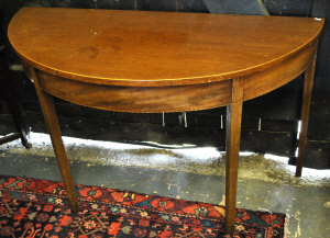 Appraisal: A pair of th century mahogany demi lune tables raised