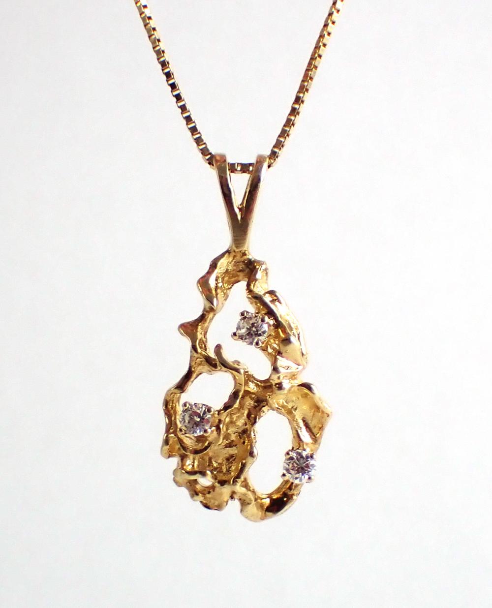 Appraisal: DIAMOND AND FOURTEEN KARAT GOLD PENDANT NECKLACE with a -