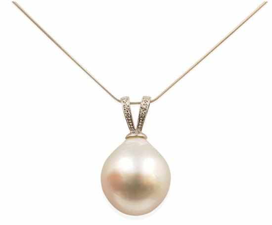 Appraisal: A SOUTH SEA PEARL AND DIAMOND PENDANT The teardrop shaped