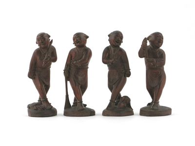 Appraisal: Four Chinese hardwood carvings of boys one with a set