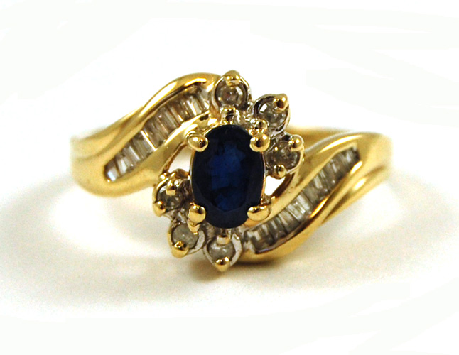 Appraisal: SAPPHIRE DIAMOND AND TEN KARAT GOLD RING with round-cut and