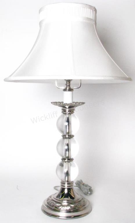 Appraisal: A crystal and silvered cast metal table lamp with shade