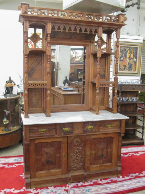 Appraisal: VICTORIAN EASTLAKE MARBLE-TOP WALNUT SIDEBOARD American th century in two