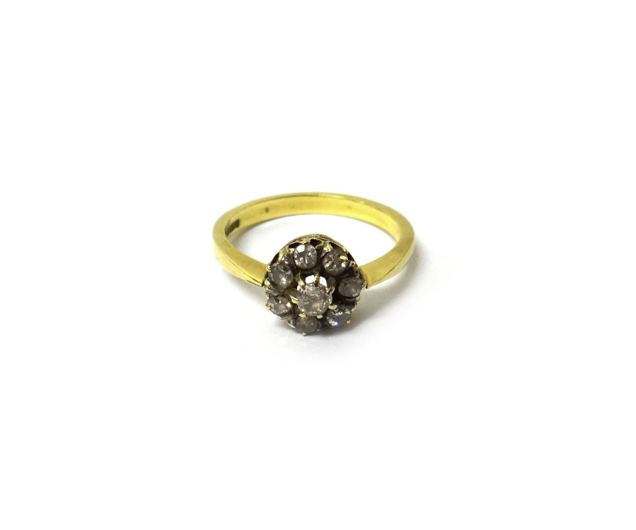 Appraisal: An ct gold and diamond set eight stone cluster ring