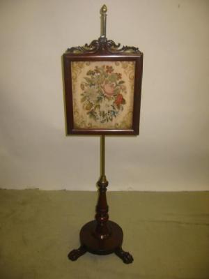 Appraisal: A VICTORIAN MAHOGANY POLE SCREEN the oblong woolwork floral panel