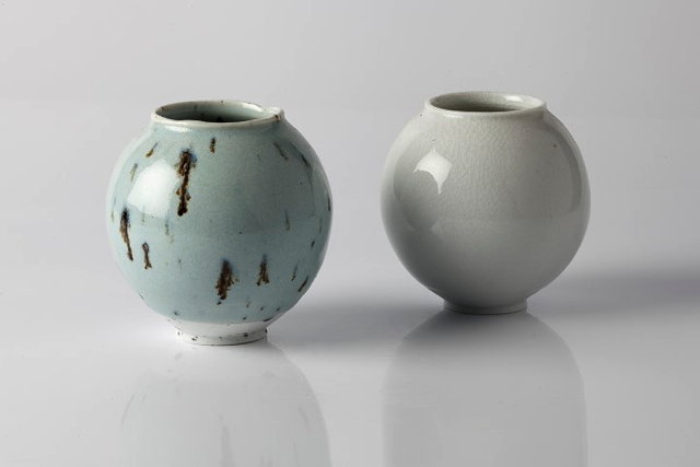 Appraisal: Adam Buick British Contemporary Two 'moon' vasesimpressed potter's sealeach cm