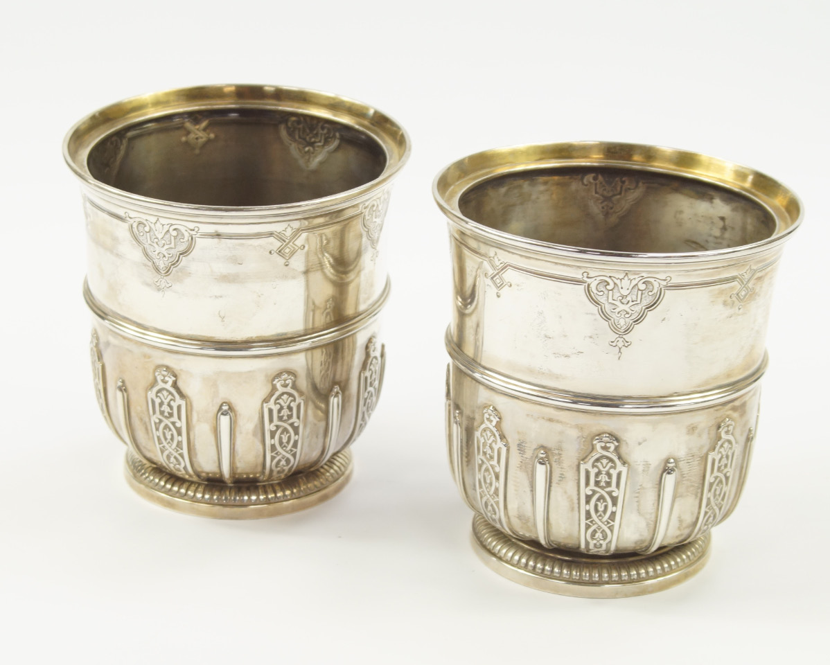 Appraisal: A pair of French white metal candle holders with fluting