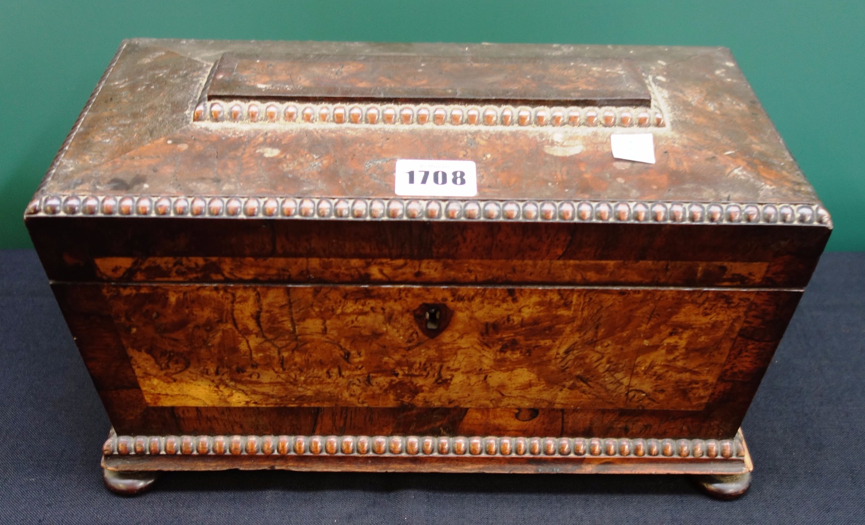 Appraisal: A William IV pollard oak and mahogany sarcophagus shaped tea