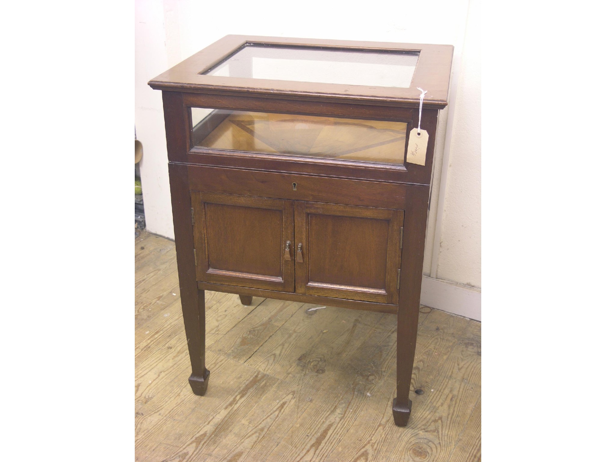 Appraisal: An early th century mahogany display cabinet display case enclosed