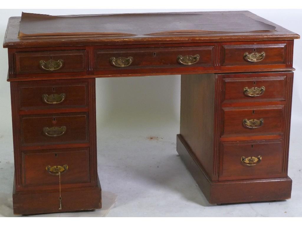 Appraisal: EDWARDIAN WALNUTWOOD TWIN PEDESTAL DESK the moulded oblong top with