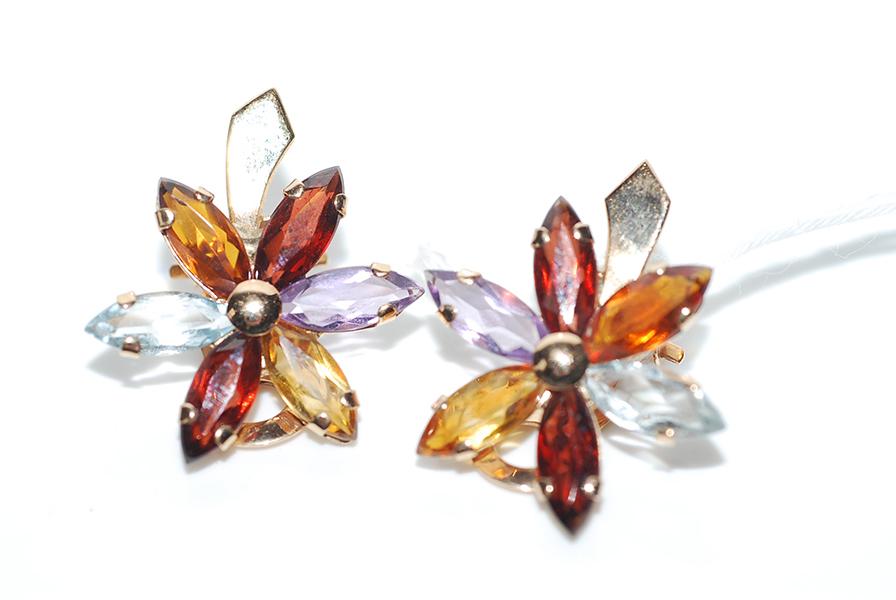 Appraisal: A PAIR OF GEM SET FLORAL EARRINGS IN CT GOLD