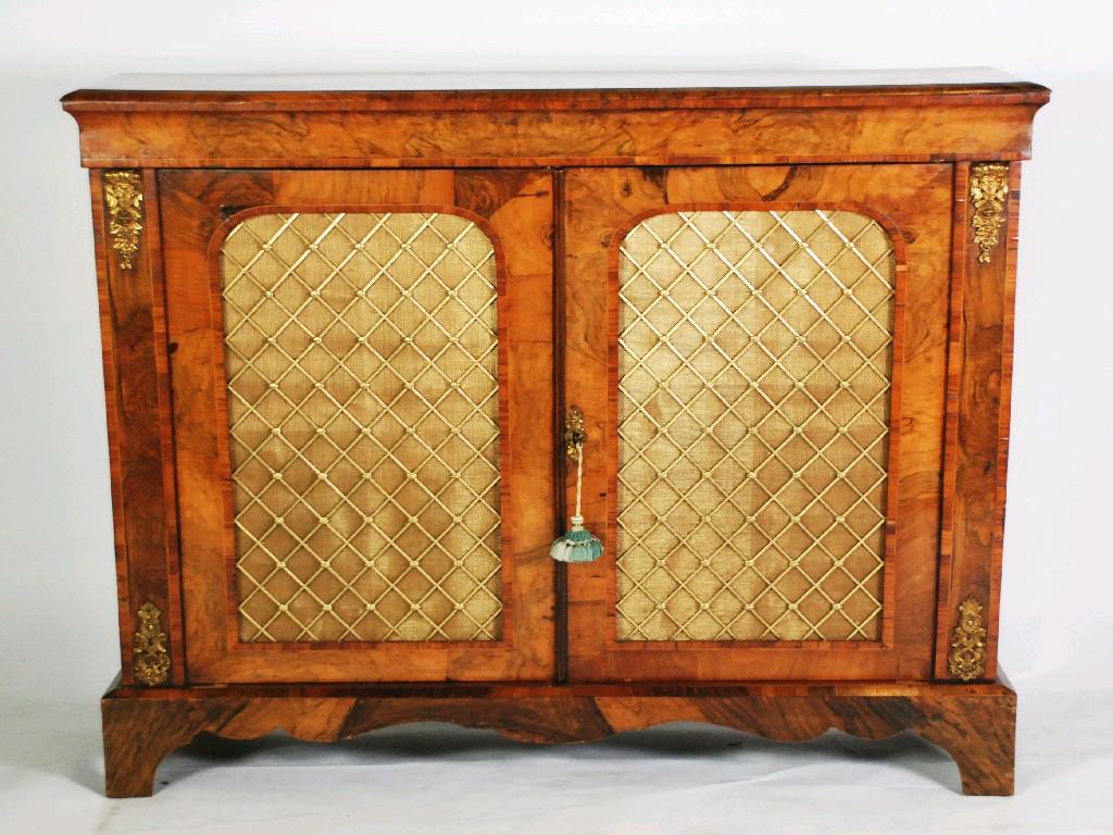 Appraisal: MID VICTORIAN FIGURED WALNUTWOOD AND CROSSBANDED SIDE CABINET with ormolu