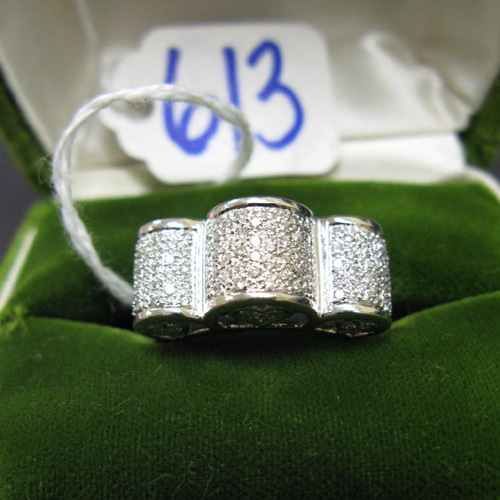 Appraisal: DIAMOND AND EIGHTEEN KARAT WHITE GOLD RING covered with pave'