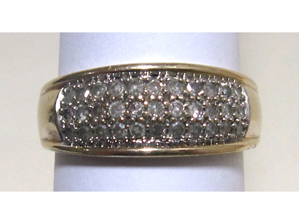 Appraisal: Nine carat gold diamond set band with brilliant cut diamonds