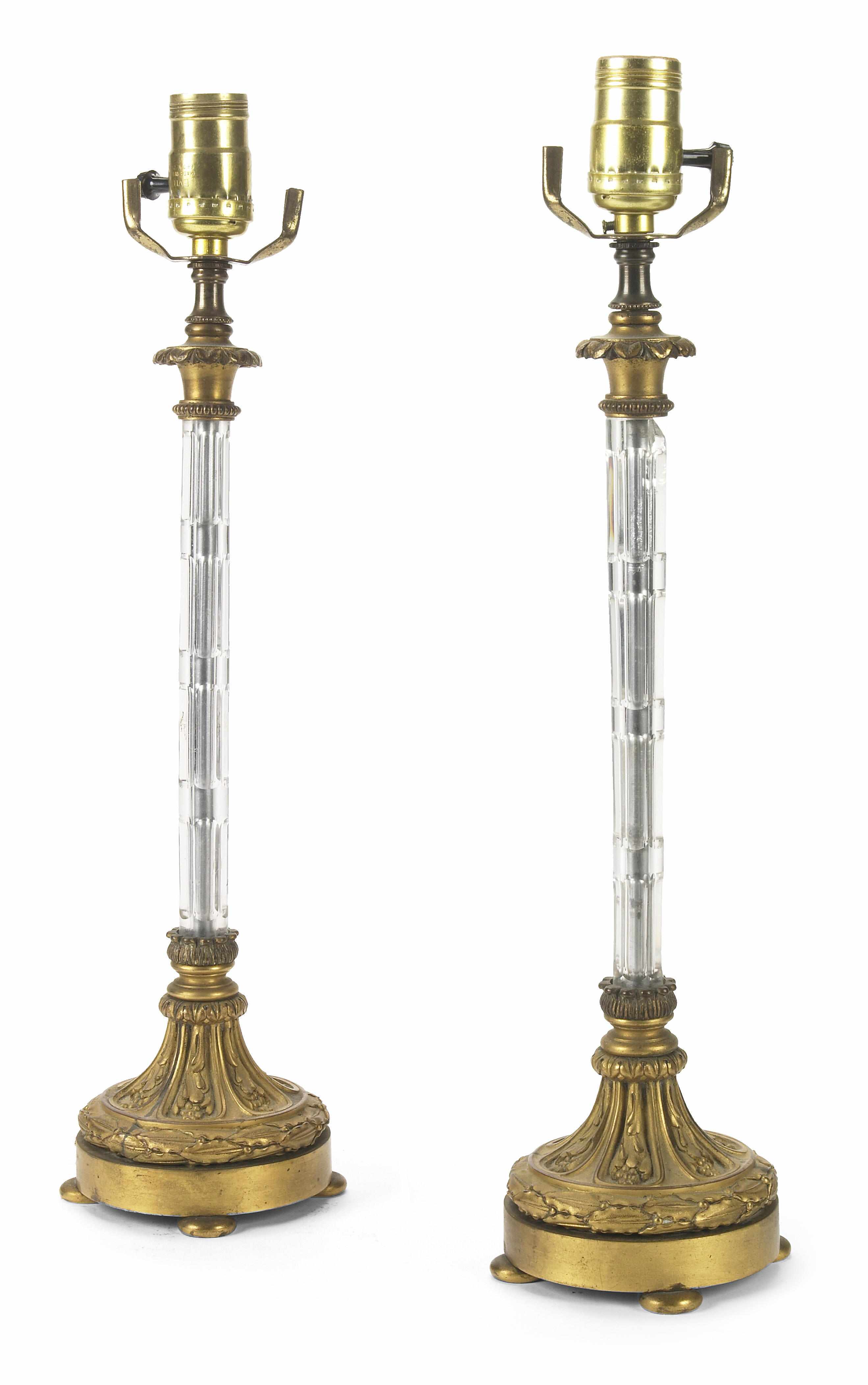 Appraisal: A pair of Neoclassical style glass and gilt metal table