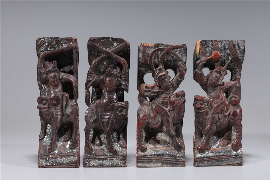 Appraisal: Group of four antique circa Chinese lacquered wood figural carvings