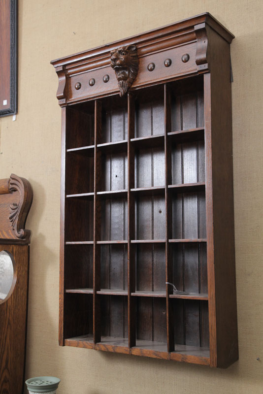 Appraisal: HANGING DISPLAY CASE Oak with carved lion head and twenty