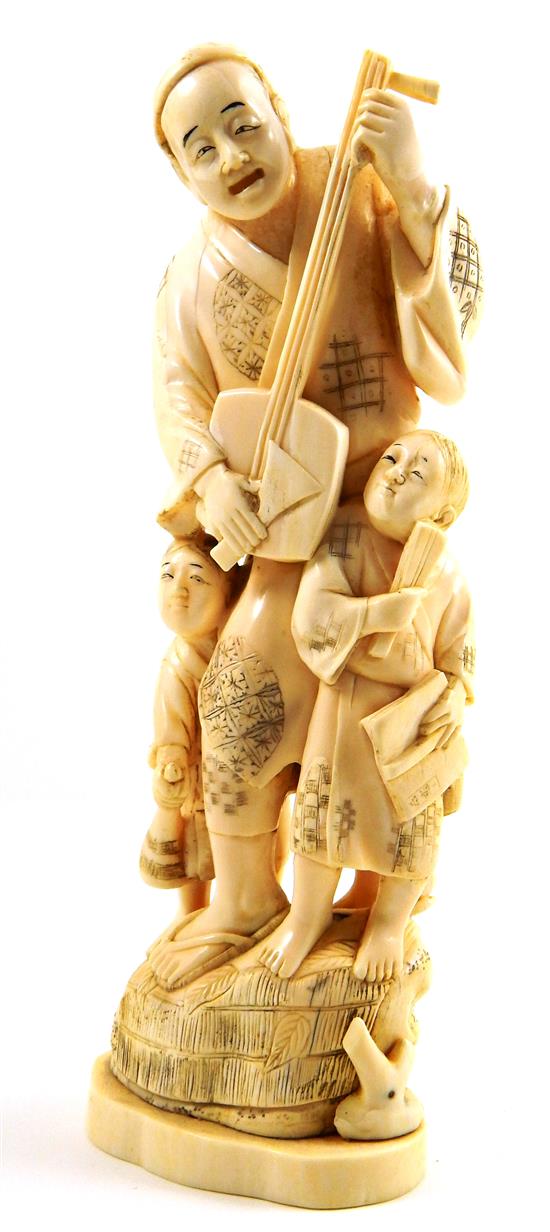 Appraisal: ASIAN Japanese ivory carving of biwa player flanked by two