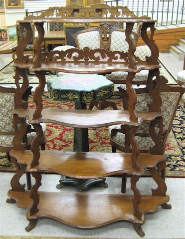 Appraisal: VICTORIAN WALNUT WHATNOT ETAGERE Rococo Revival American late th century