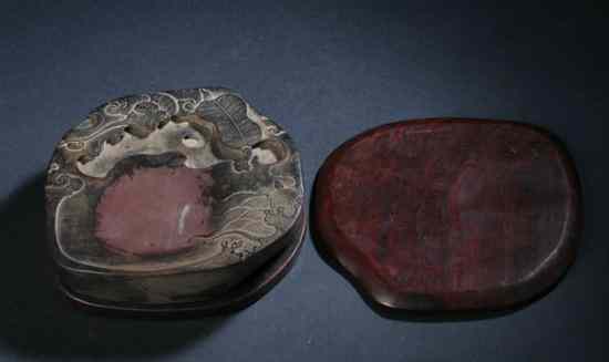 Appraisal: CHINESE CARVED PEACH-FORM INKSTONE AND ROSEWOOD BOX Inkstone with bat