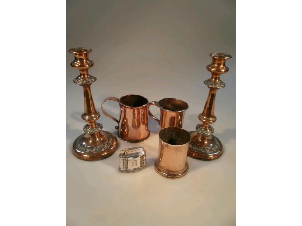 Appraisal: A pair of old Sheffield plate candlesticks three tankards and