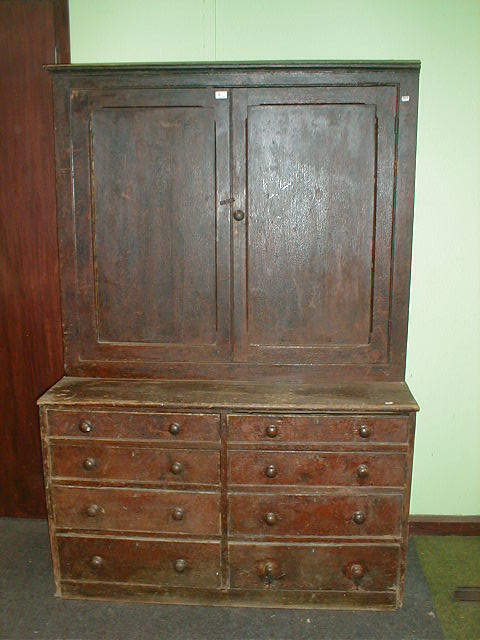 Appraisal: A thC pine cabinet with two panelled door top and