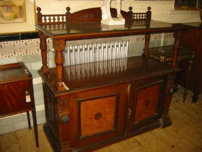 Appraisal: A VICTORIAN OAK AND EBONY TWO TIER BUFFET the ledge